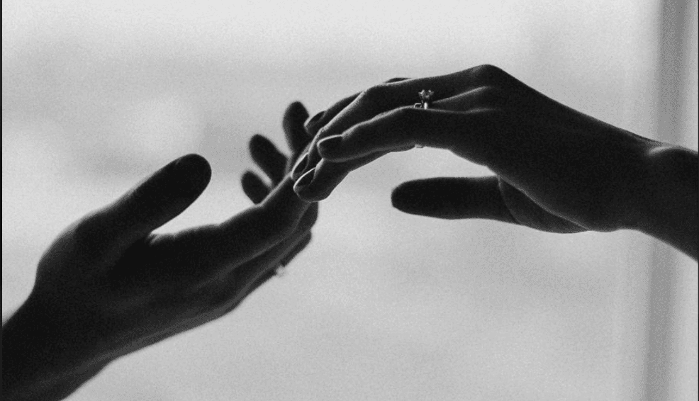 Hands with engagement ring